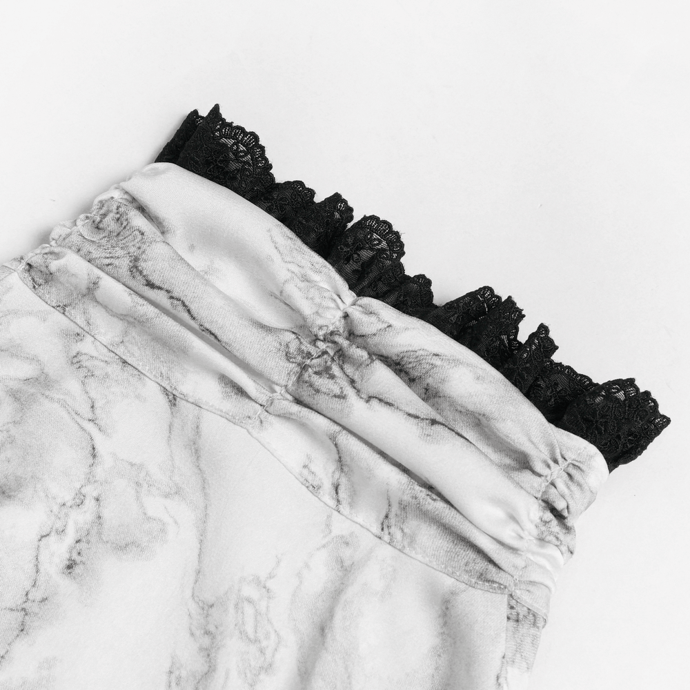 White Gothic Marble Shirt with Lace Ruffle Bib showcasing a marble print and elegant black lace ruffle details.