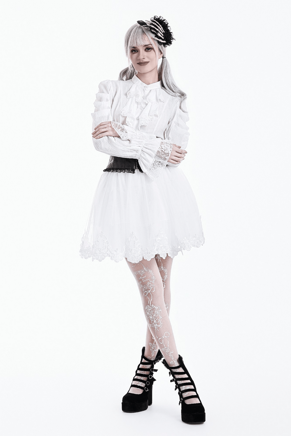 Model wearing a White Gothic Tulle Skirt with Embroidered Lace Hem, styled with a vintage-inspired blouse and accessories.