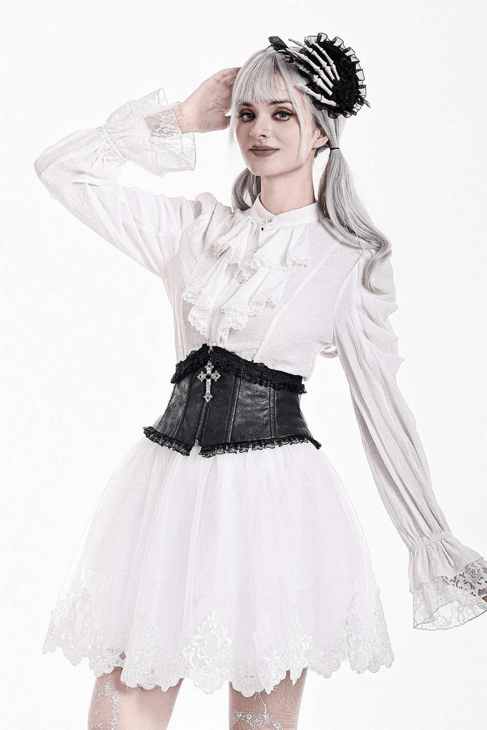 Model wearing a White Gothic Tulle Skirt with Embroidered Lace Hem, styled with a ruffled blouse and black corset.