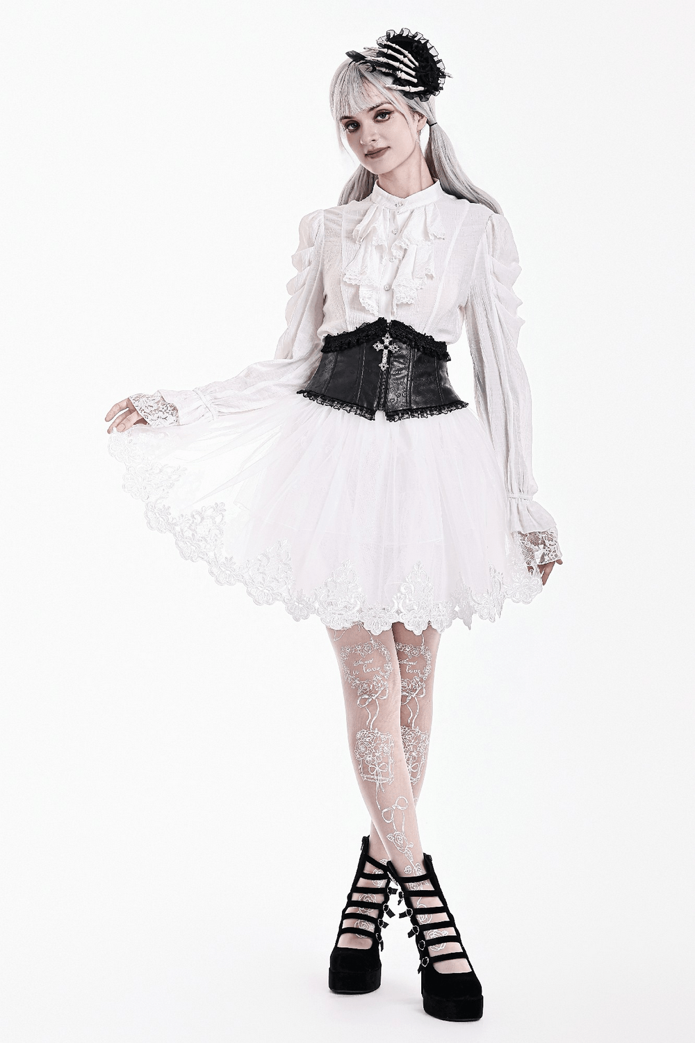Model wearing a White Gothic Tulle Skirt with Embroidered Lace Hem, paired with a corset and lace tights.