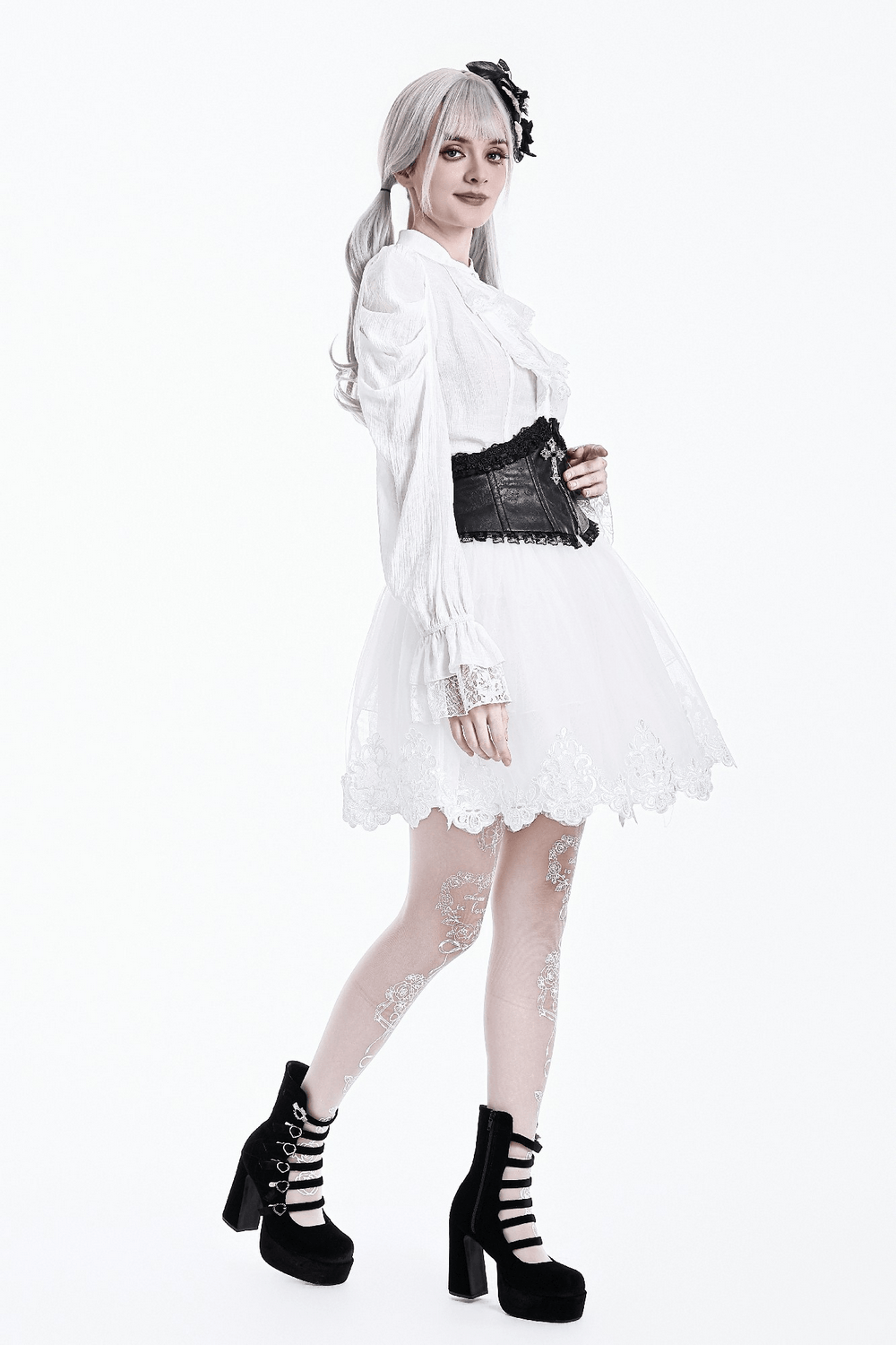 Model showcasing the White Gothic Tulle Skirt with Embroidered Lace Hem, styled with a blouse and corset.