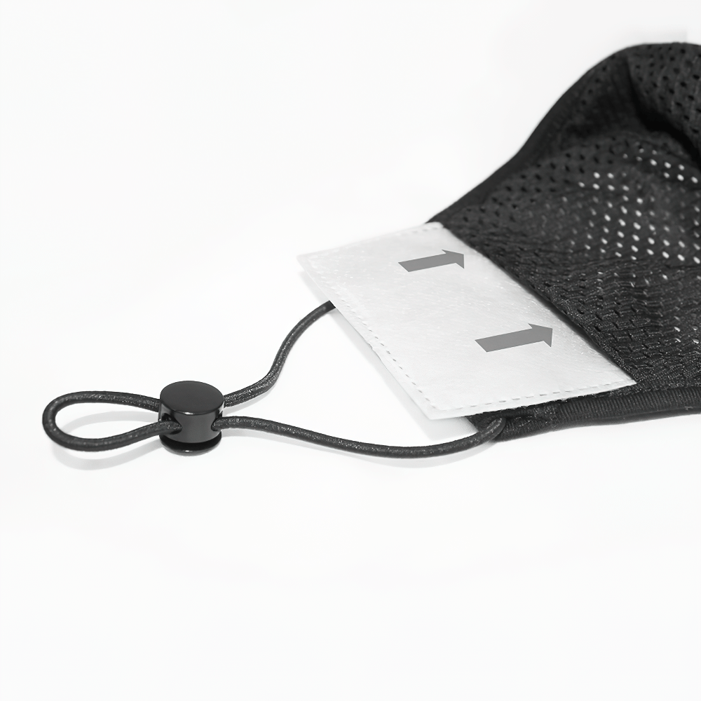 Close-up of a black mesh mask with adjustable ear loops and a labeled size tag for a perfect fit.