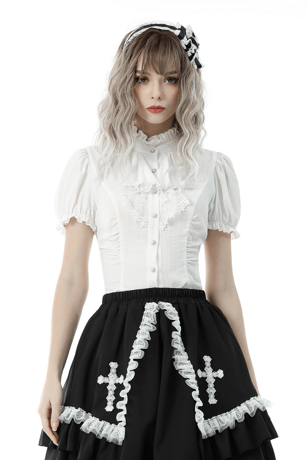 Victorian-inspired white blouse with ruffle neckline and puff sleeves, paired with a black skirt for a charming look.