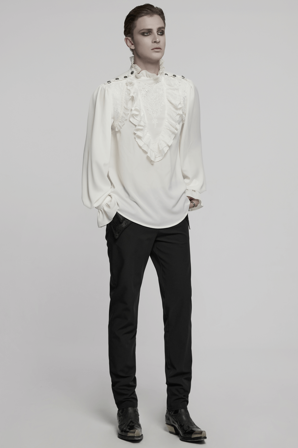 Gothic glamorous white shirt with ruffles and snap buttons, paired with dark pants for a stylish look.