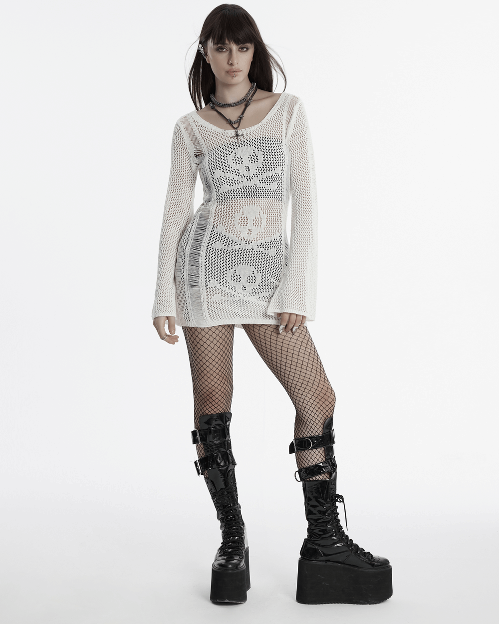 White punk skull mesh knit dress with long sleeves, featuring a bold skull pattern and edgy platform boots.