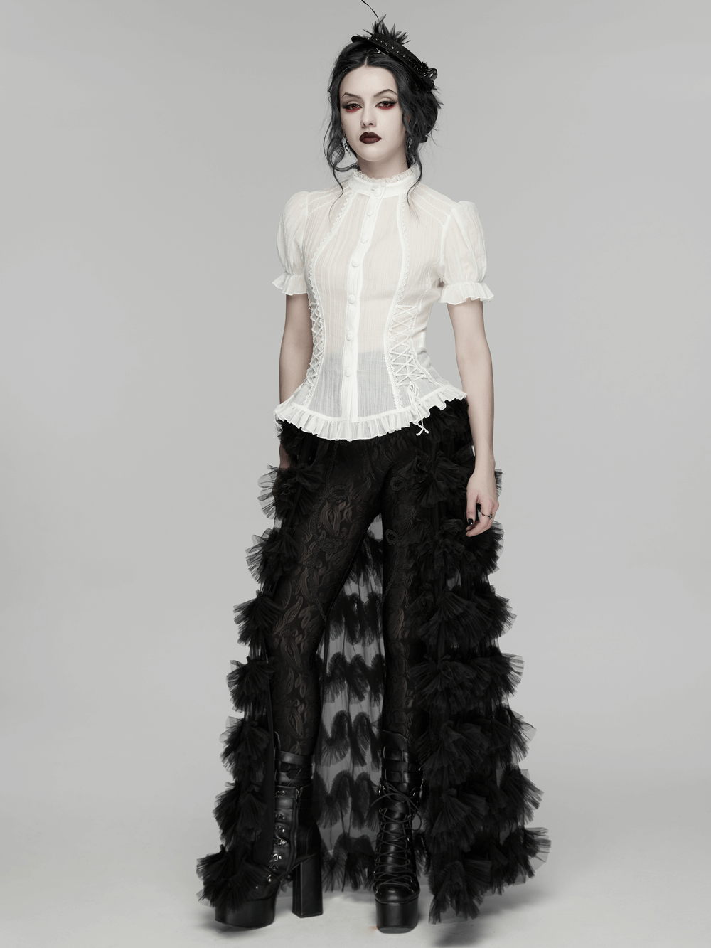 White Retro Lace-up Corset Blouse with Puff Sleeves paired with gothic pants and dramatic ruffled skirt.