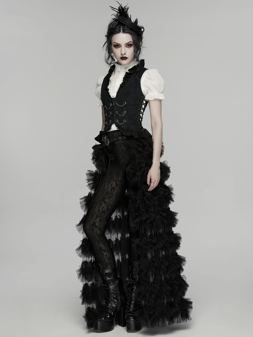 Gothic-inspired model wearing a dramatic black outfit with ruffled skirt and corset detail, showcasing a vintage aesthetic.