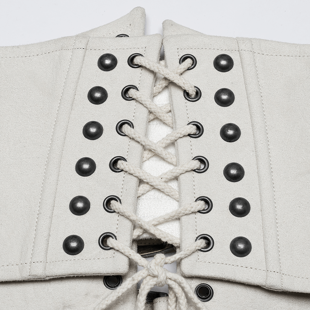 Close-up of white underbust corset with lace-up back and bold metal eyelets for a punk retro style.