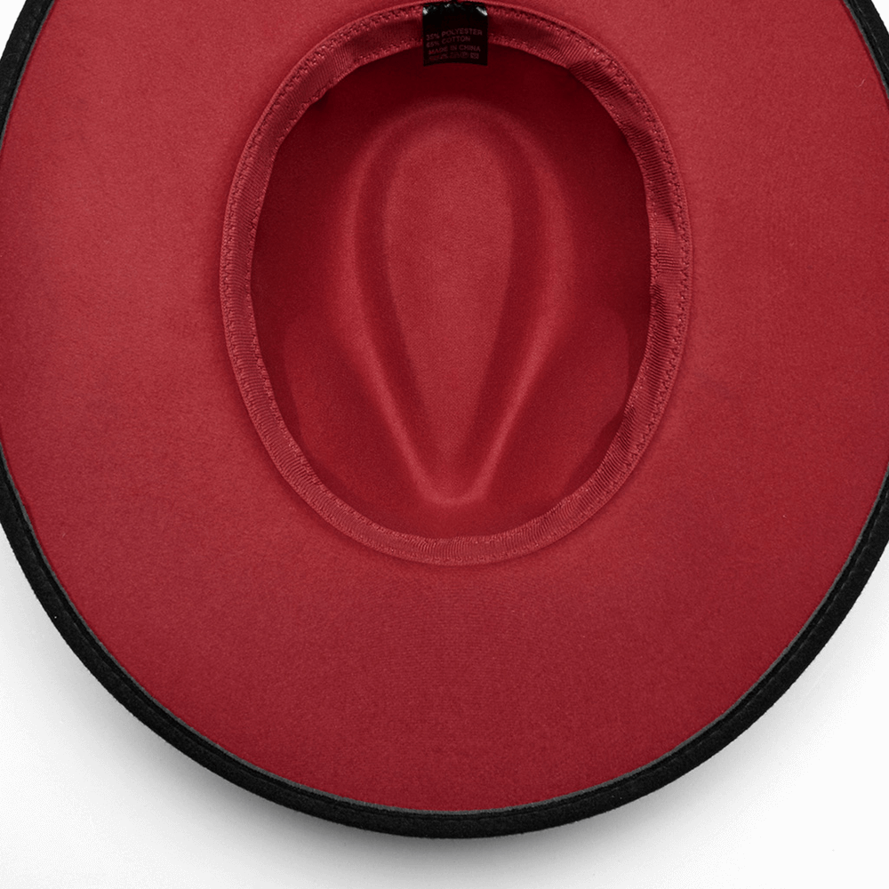 Inside view of wide brim suede gothic hat showcasing rich red lining and elegant craftsmanship.