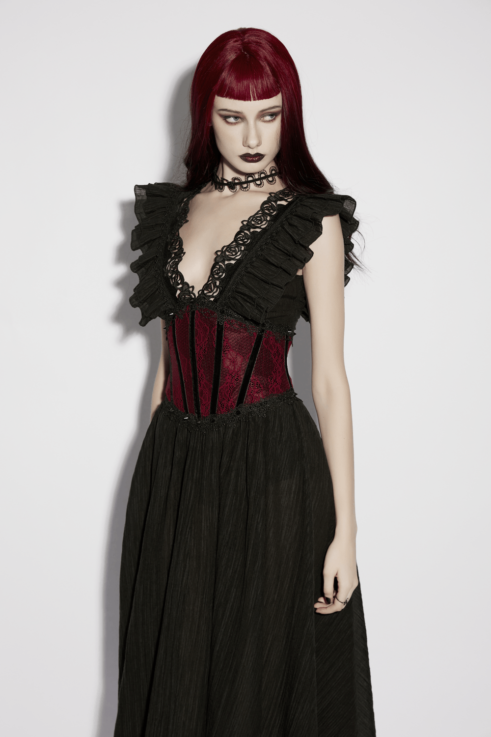Alt Tag: Wine Red Black Lace Up Gothic Waist Cincher Corset on model, red-and-black lace-up corset paired with black gothic dress