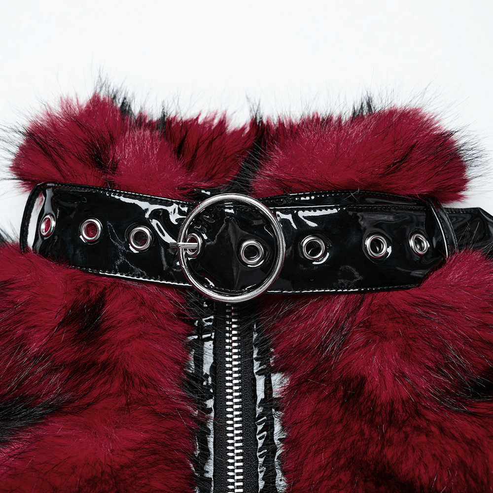 Close-up of wine red faux fur jacket with glossy black patent belt and silver buckle detail.