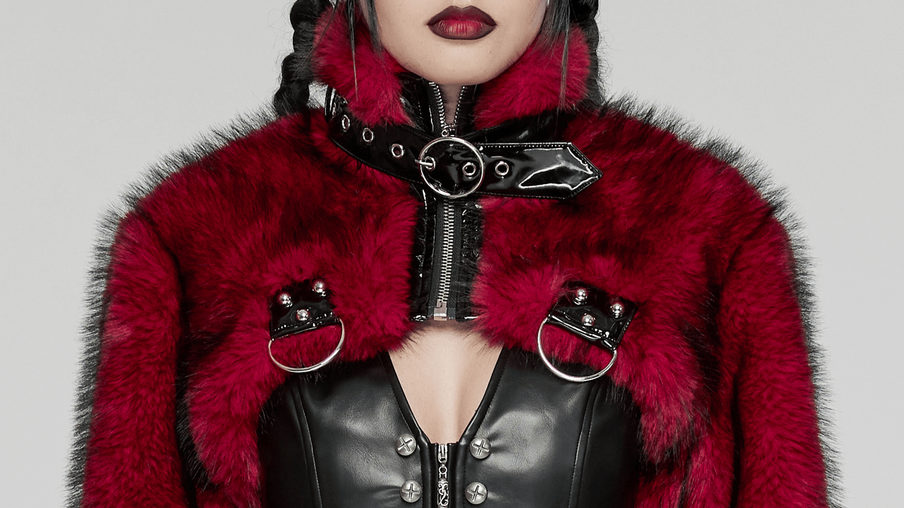 Edgy wine red faux fur punk jacket with patent details, featuring a short collar and bold hardware accents.