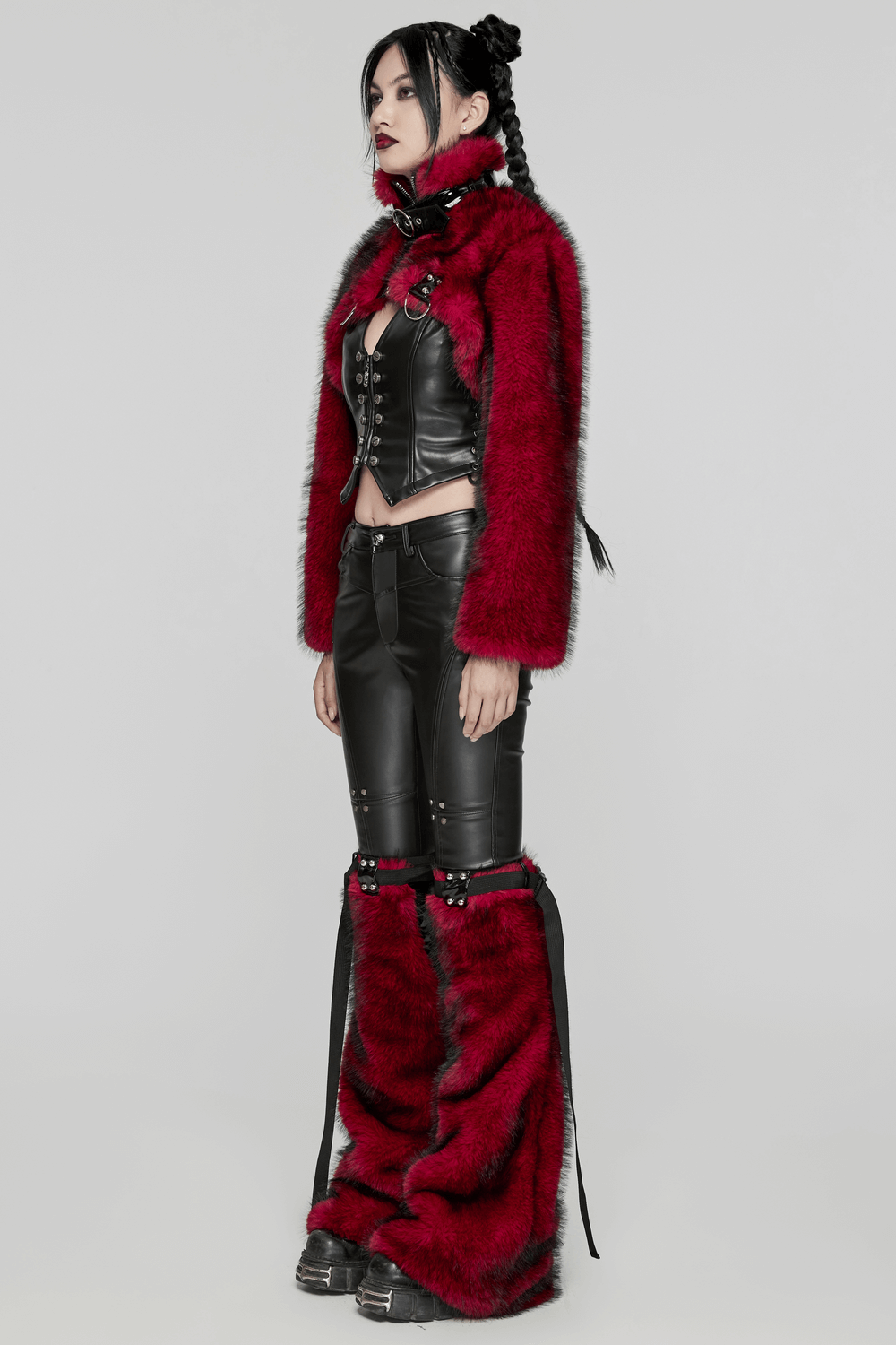 Stylish woman in a wine red faux fur punk jacket, black corset, and trendy black pants, showcasing edgy fashion.
