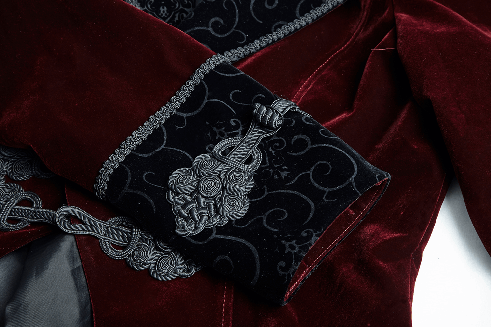 Close-up of the elegant wine red Gothic jacket's rich velvet fabric and ornate cuff detailing.