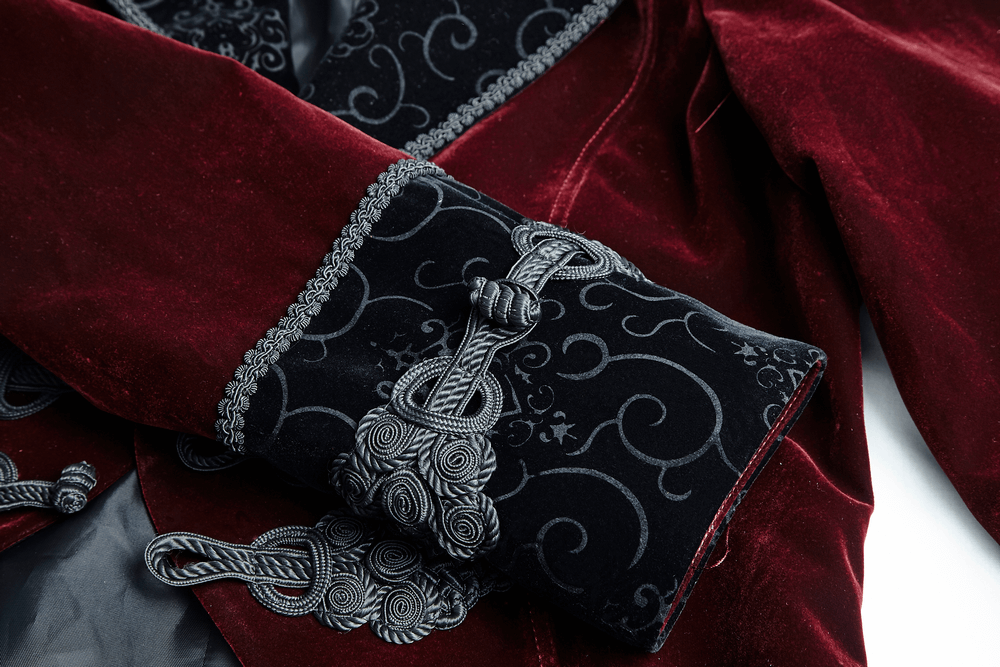 Elegant wine red Gothic jacket cuff with intricate black embroidery and classical button detailing.