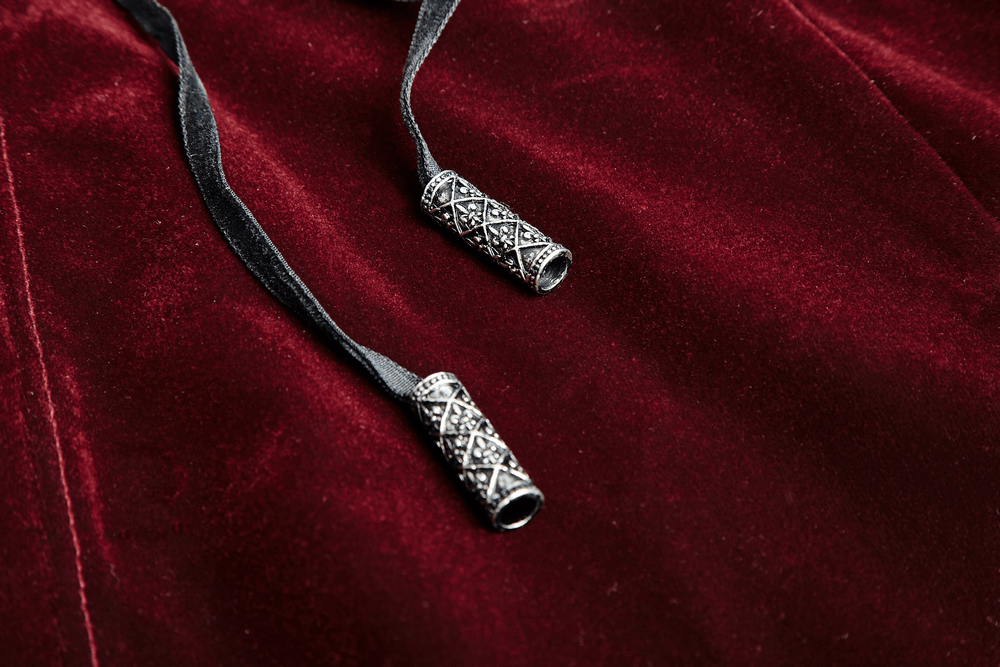 Wine red velvet fabric with intricate silver toggles and black ribbons for a gothic jacket.