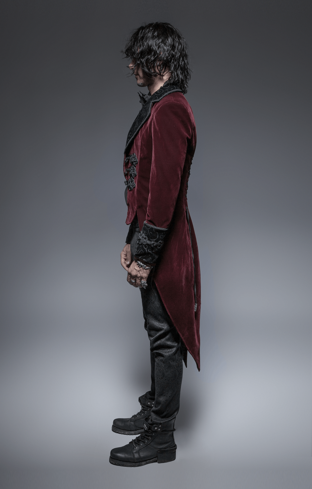 Side view of a wine red Gothic jacket with scissor tail detail, showcasing elegant flannel and ornate buttons.