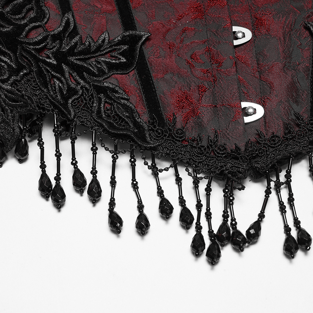 Alt Tag: Wine Red Jacquard Gothic Underbust Corset with Fringe close-up, black rose applique, front busk hooks, beaded tassel fringe