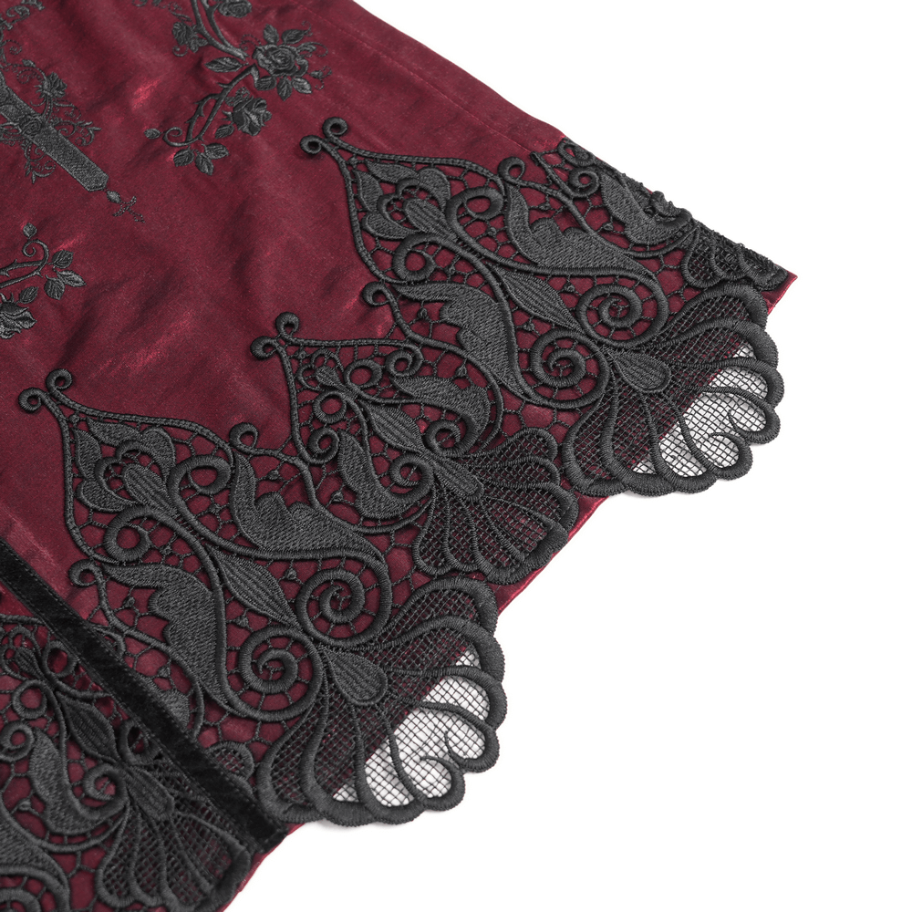 Intricate black lace hem on a wine red maxi skirt, showcasing detailed embroidery and gothic-inspired design.