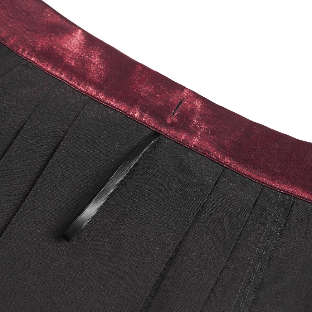 Close-up of wine red waistband with black tie detailing on a Victorian-inspired maxi skirt.