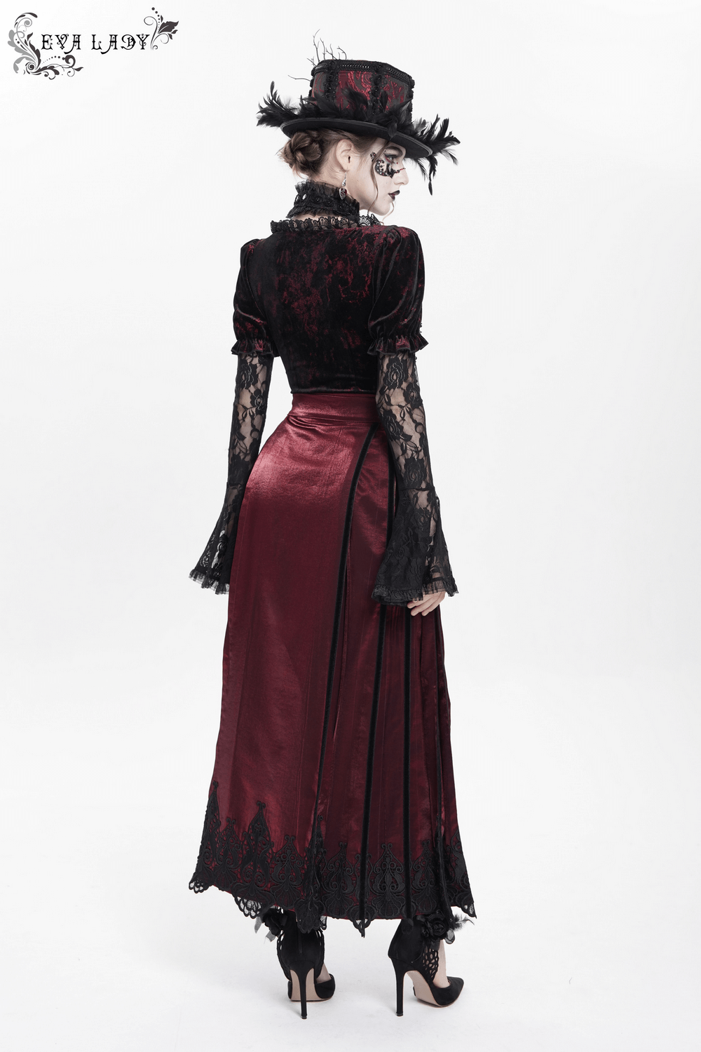 Elegant woman in a wine red maxi skirt with black lace hem and stylish hat, showcasing gothic Victorian-inspired fashion.