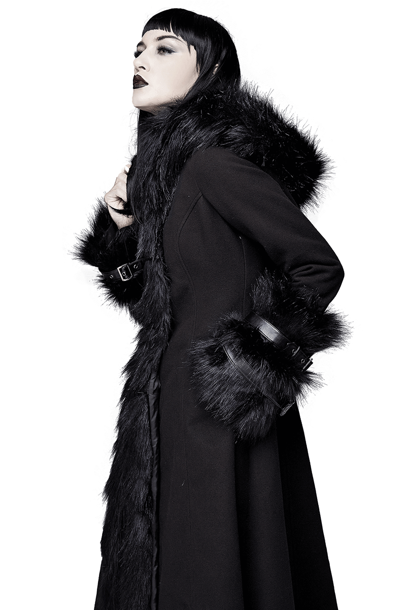 Elegant woman in a black long gothic coat with fur details, showcasing vintage style and alternative fashion.