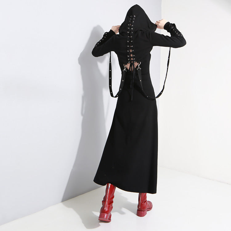 Back view of women’s black gothic long dress with lacing details and hood, paired with stylish red knee-high boots.