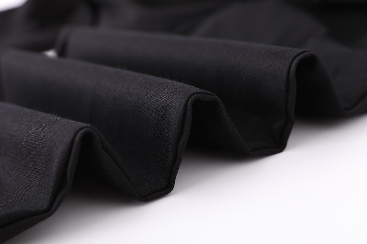 Close-up of black fabric folds showcasing the soft texture of women's high waist cargo joggers.