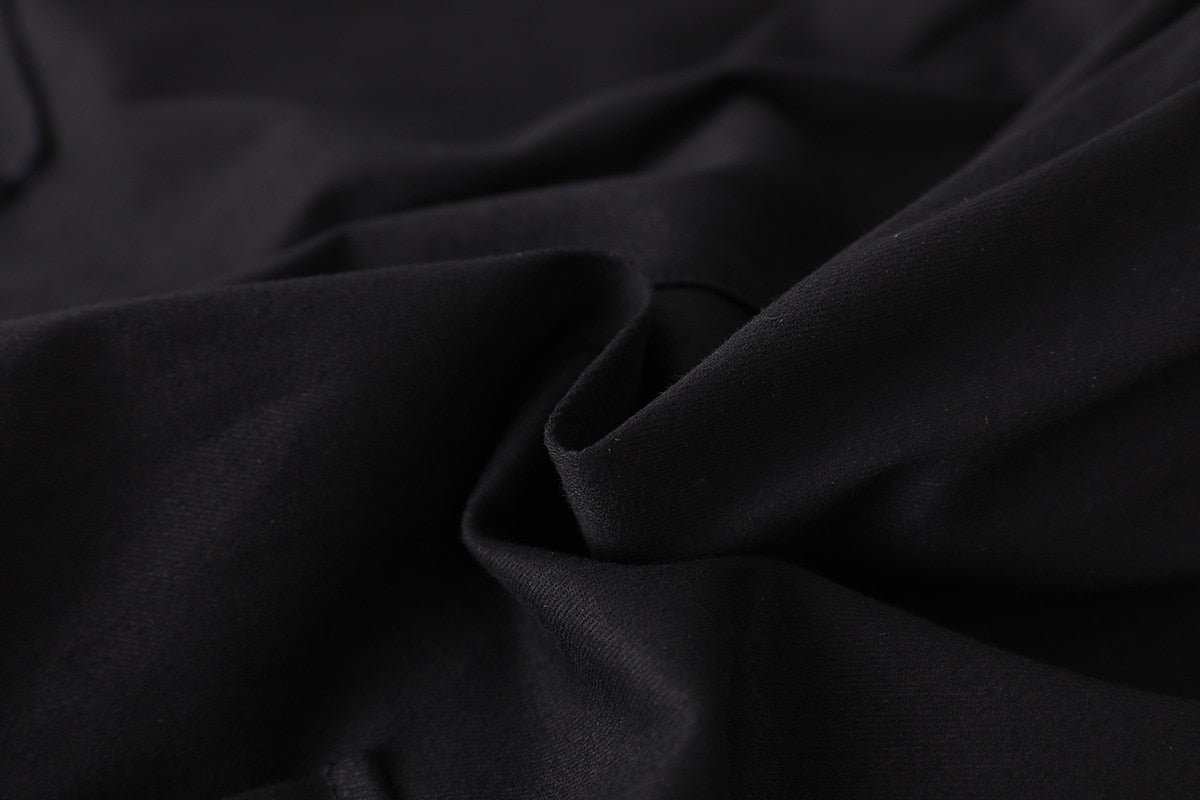 Close-up of black polyester fabric showcasing a soft texture, ideal for women's high waist cargo joggers.