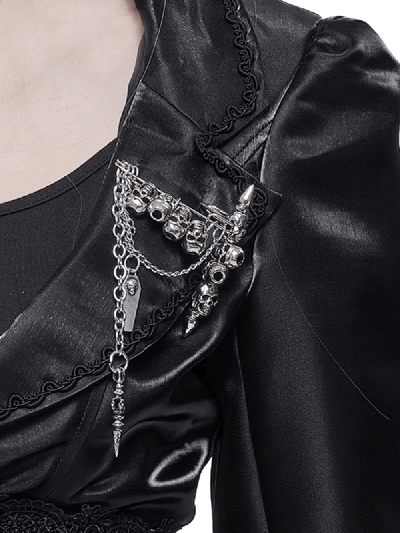 Gothic women's skull chain brooch with intricate details on a black satin jacket, perfect for alternative fashion.