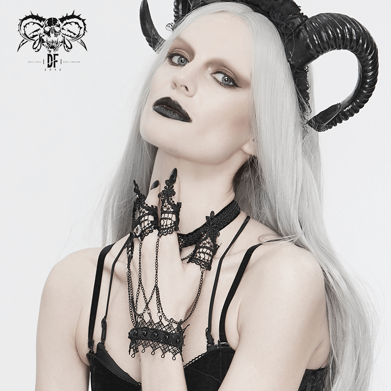Gothic Victorian black lace gloves with chains, worn by a model with horns and dramatic makeup.