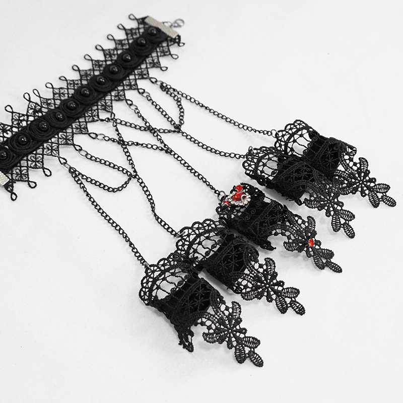 Elegant black lace gloves with chains and decorative red accents, perfect for gothic and Victorian-inspired looks.