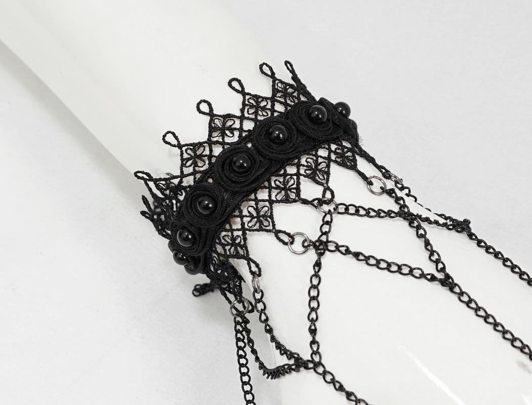 Elegant black lace bracelet with chain details, perfect for Victorian gothic or alternative fashion accessories.