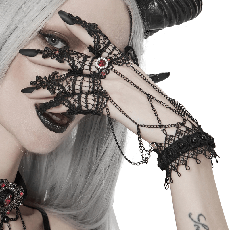 Women's gothic black lace gloves with chains, perfect for a Victorian-inspired fashion statement.