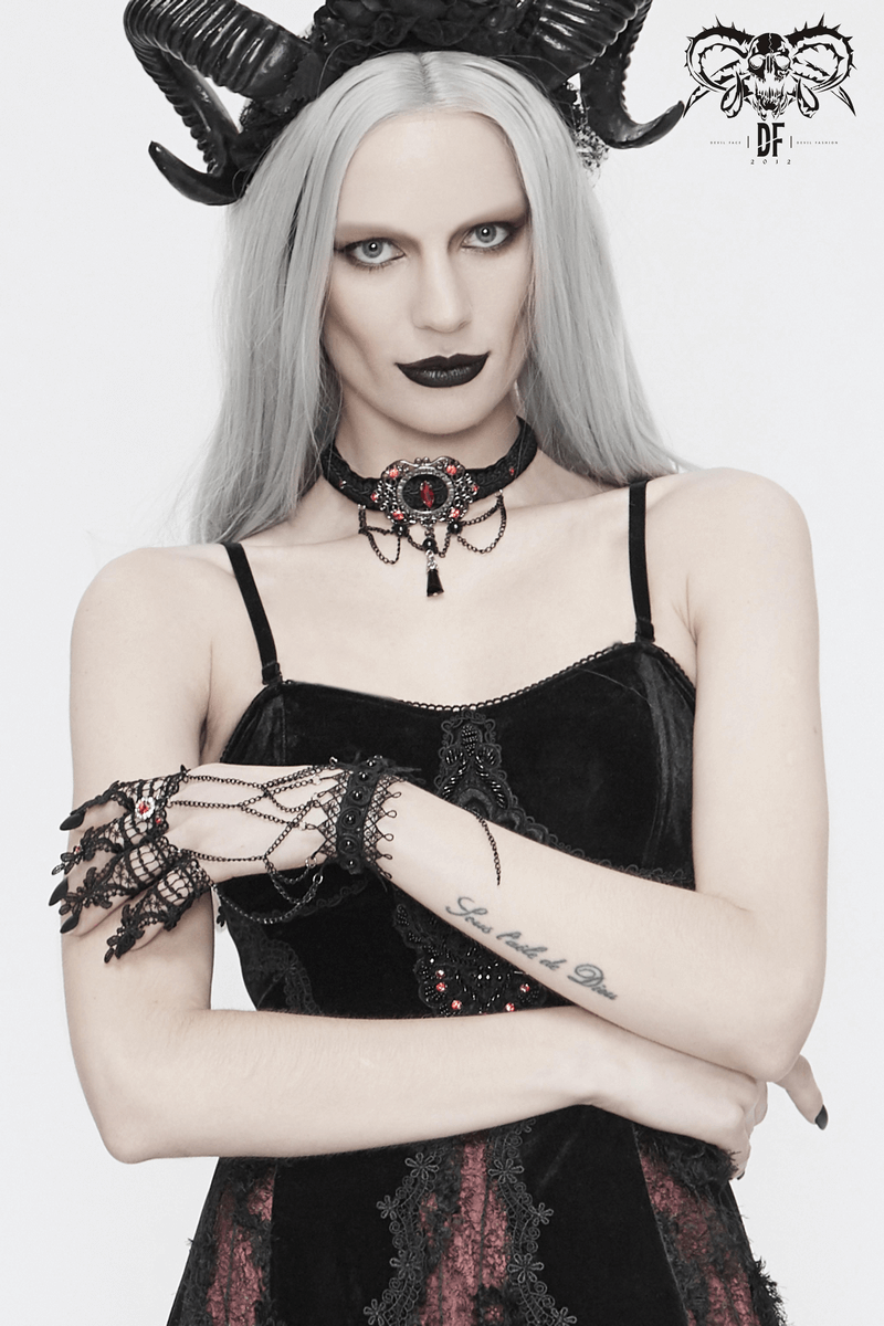 Elegant model wearing gothic black lace gloves and dark accessories, embodying Victorian style and an alternative aesthetic.