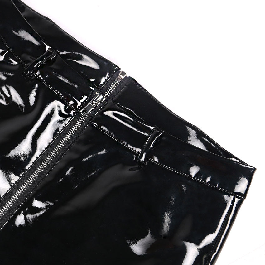 Close-up of shiny black PU leather leggings showcasing zipper and glossy finish for a trendy look.