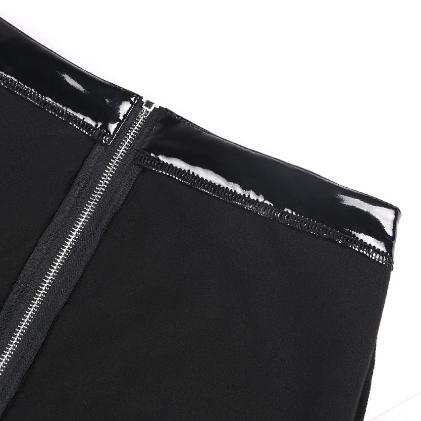 Close-up of black shiny PU leather leggings with a stylish back zipper detail.