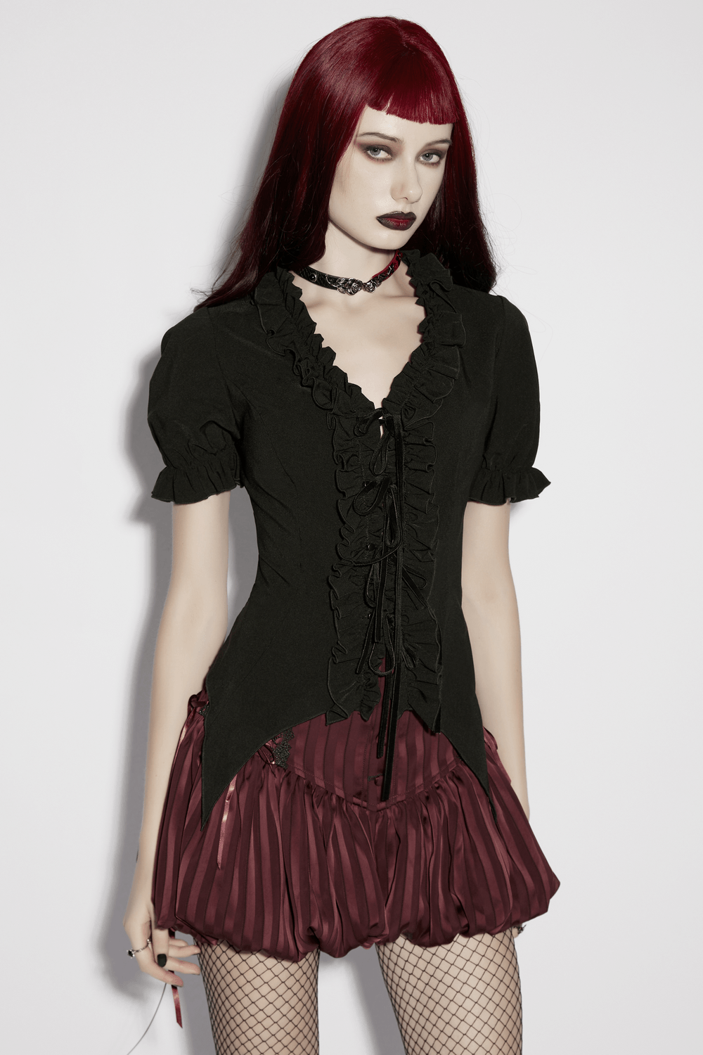 Alt Tag: Women's Adorable Gothic Victorian Blouse with Tie-Up on model, black ruffled tie-front top with choker and burgundy skirt