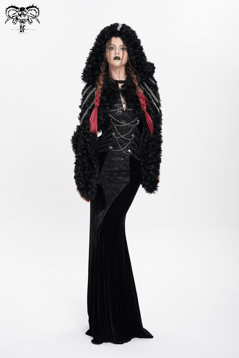 Gothic women in faux fur hooded cape with chains, styled for alternative fashion and festivals.