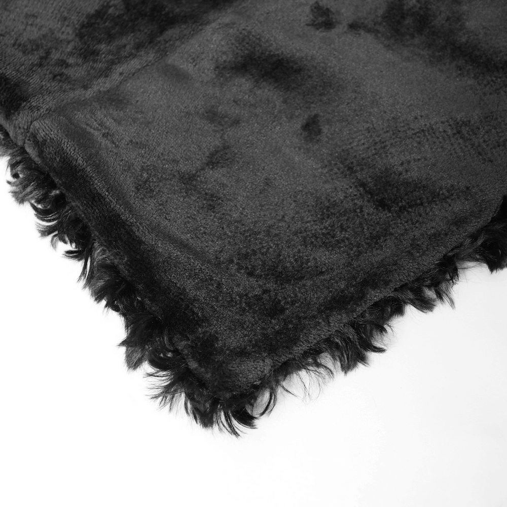 Close-up of soft black faux fur fabric with wavy edges, perfect for gothic fashion and cozy styles.