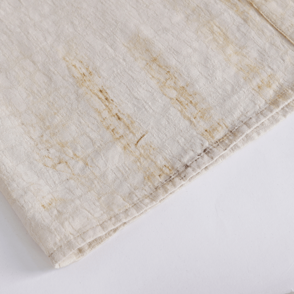 Close-up of the textured fabric showing antique ruffle details of women's vintage shirt.