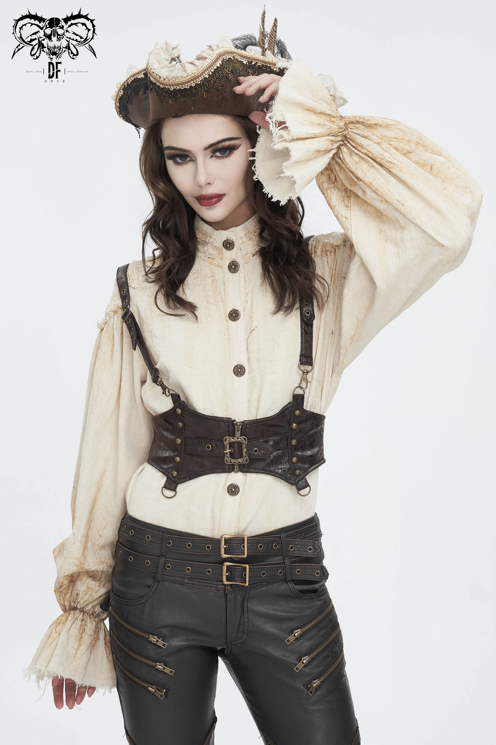 Woman in antique ruffle sleeves shirt with button front and stylish hat, embodying vintage elegance.