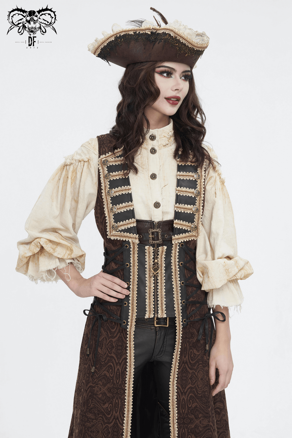 Woman in vintage pirate costume with elaborate hat and buttoned shirt, showcasing elegant ruffle details.