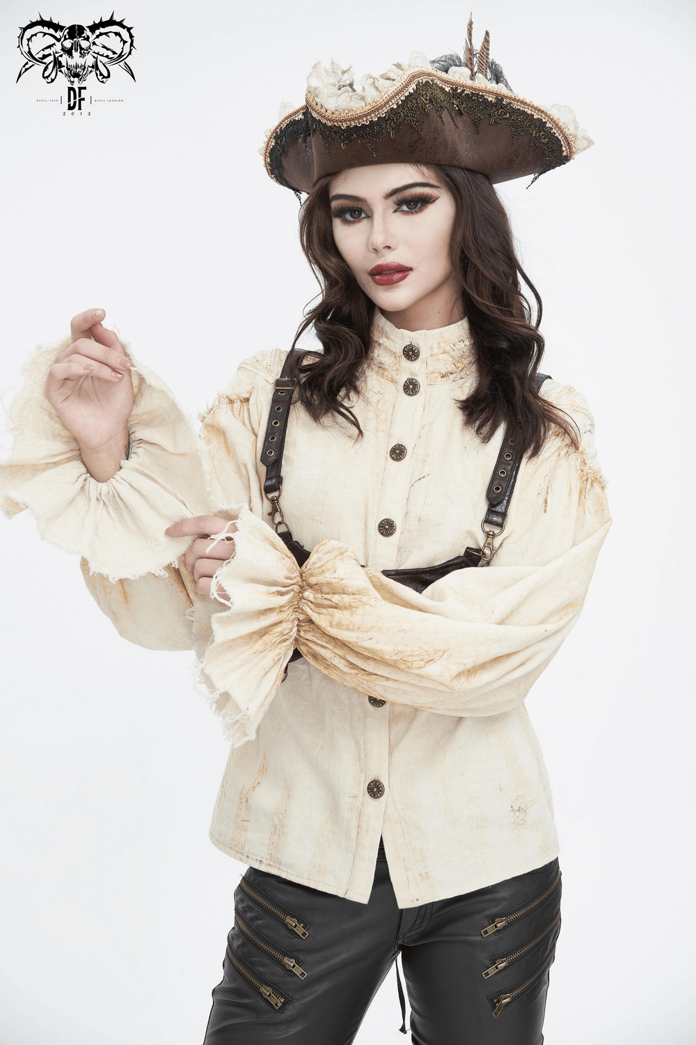 Woman in vintage pirate-inspired shirt with ruffles and hat, showcasing an elegant blend of classic and adventurous style.