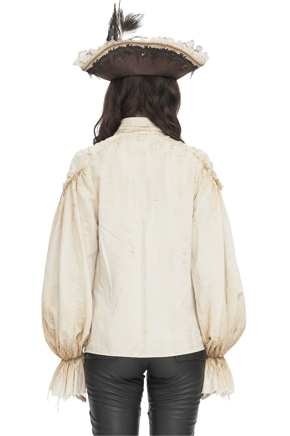 Back view of a woman wearing an antique ruffle sleeves shirt with a pirate hat and stylish pants.