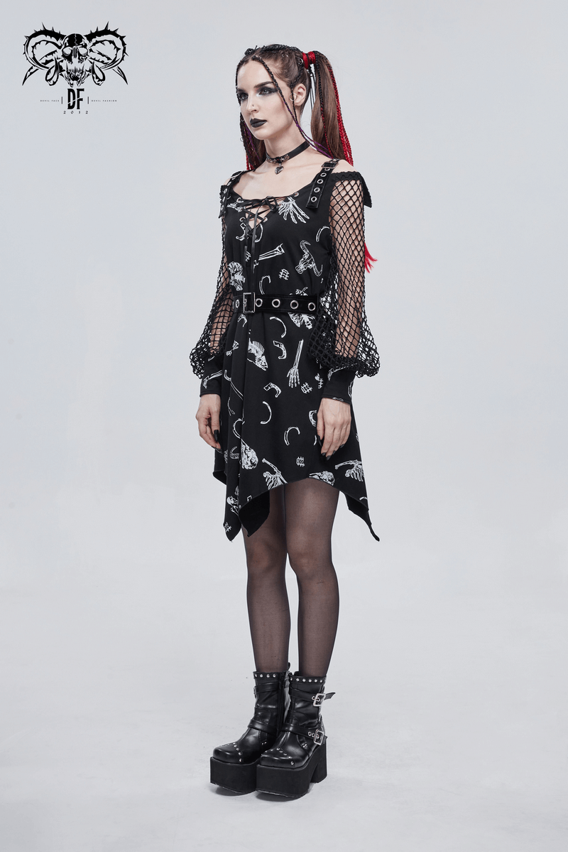 Model wearing a black asymmetrical gothic dress with buckle straps and mesh sleeves, showcasing edgy fashion.