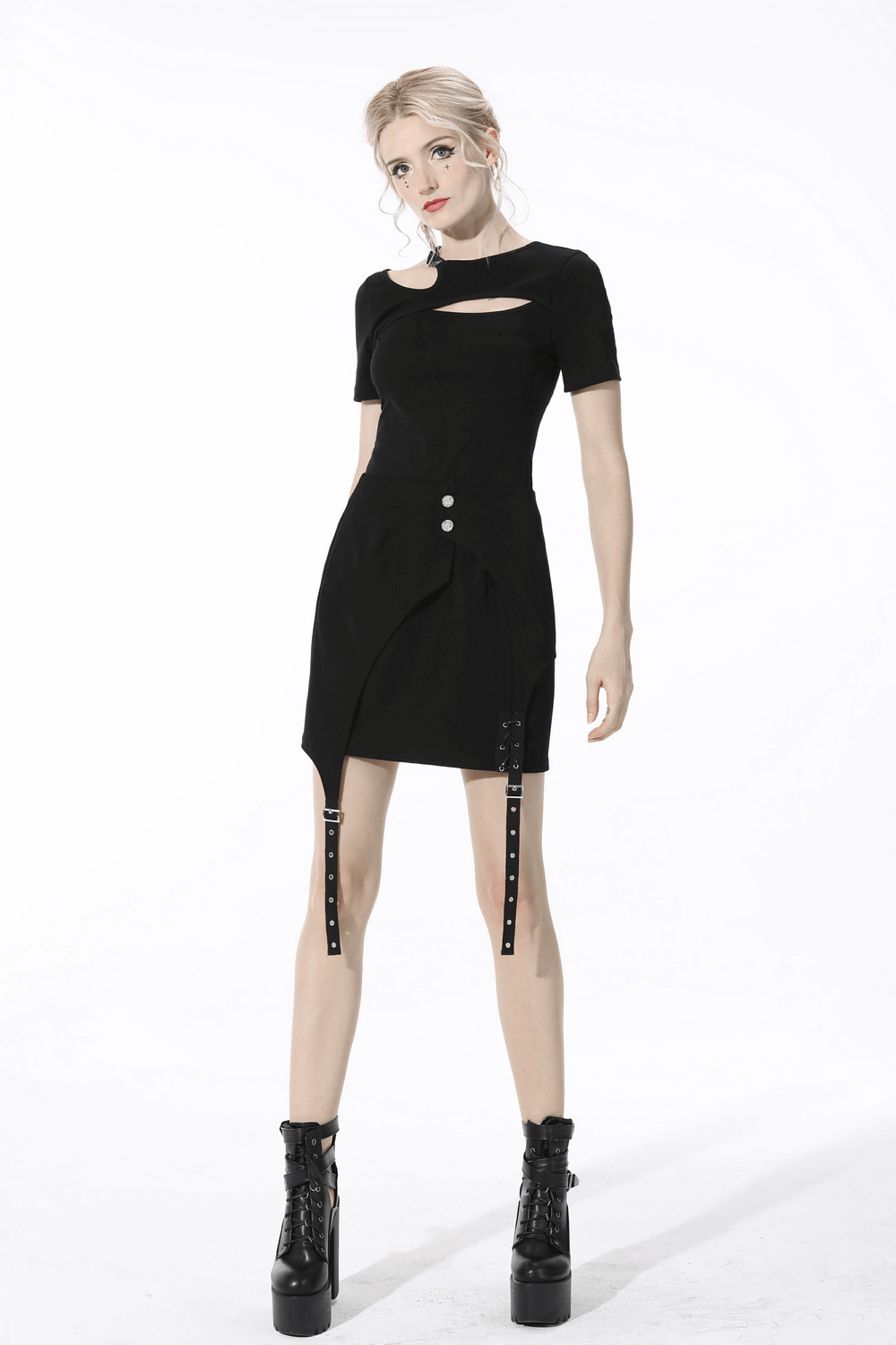 Women's black asymmetrical mini skirt with buttons and straps, styled with combat boots for a punk rock look.