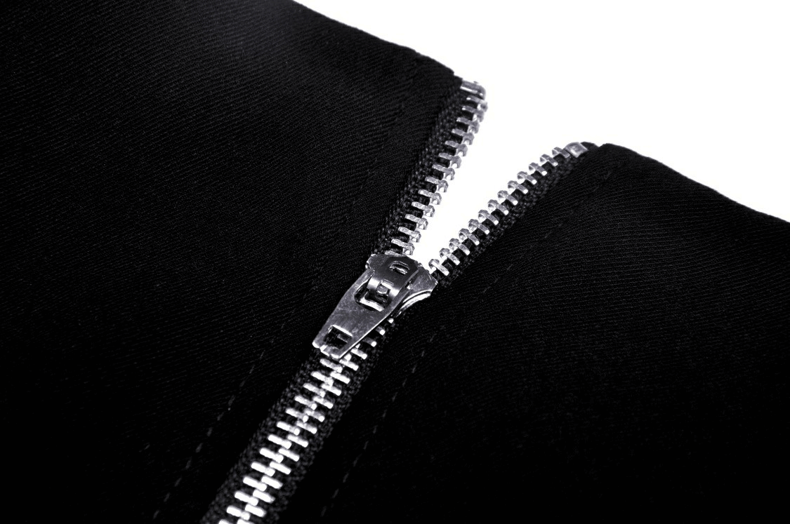 Close-up of a sleek black zipper detail on stylish clothing, highlighting modern fashion design.
