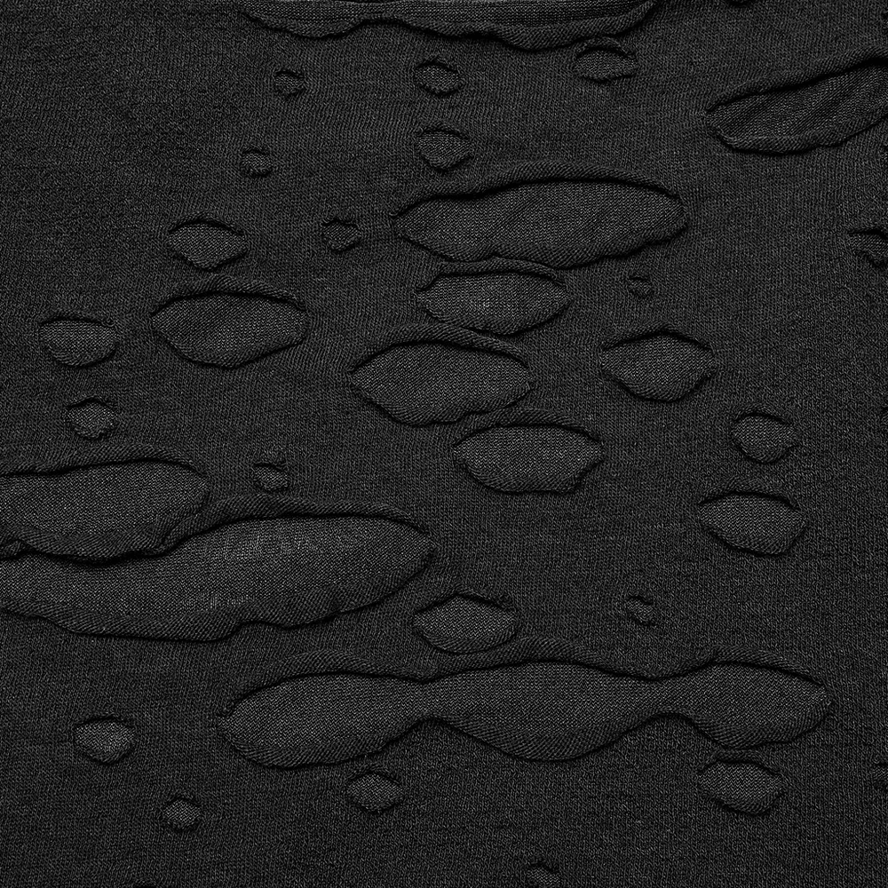 Close-up of textured black mesh fabric with edgy distressed details, perfect for punk fashion.