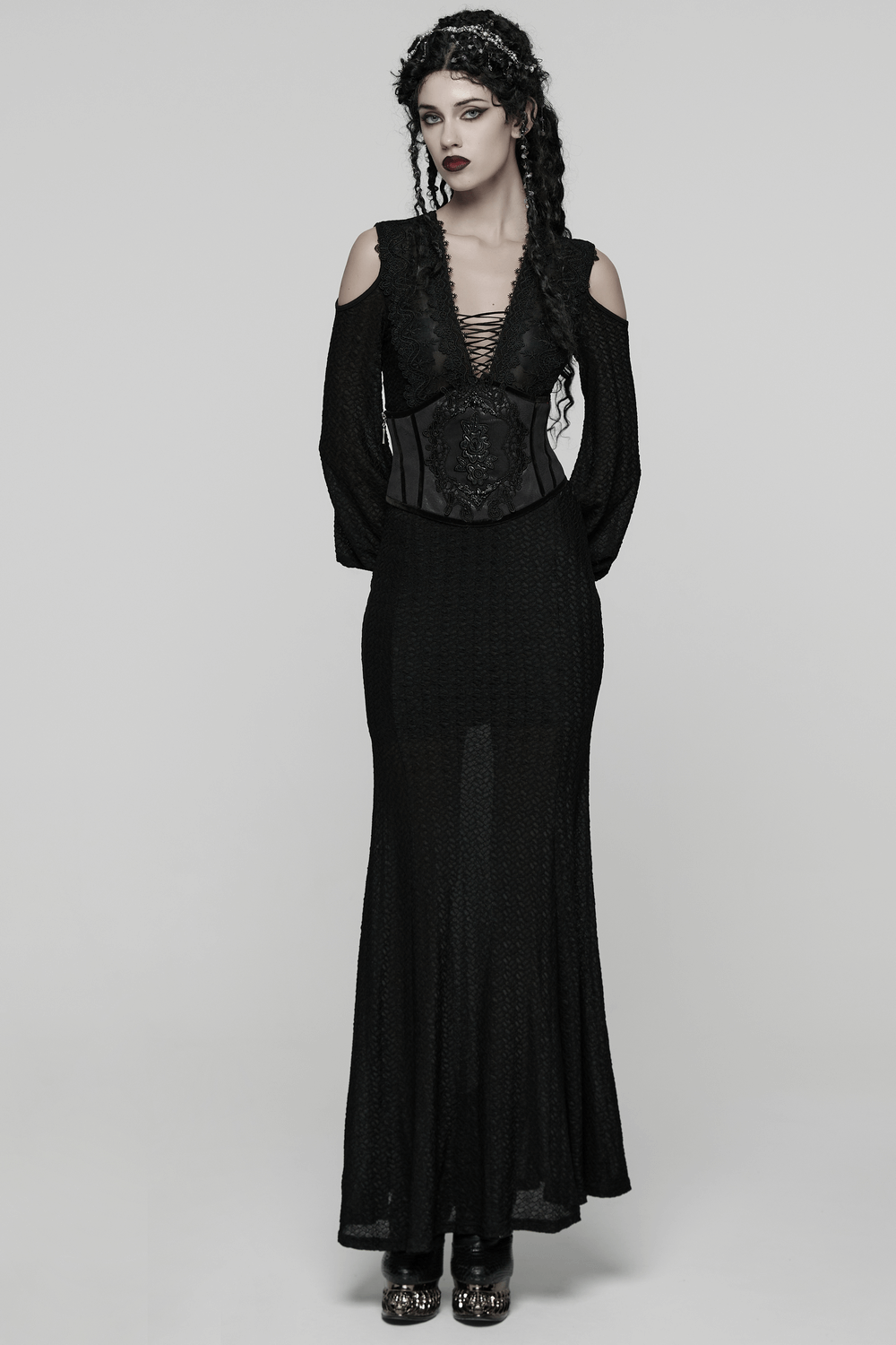 Women's Black Corset Belt with Embroidered Appliques worn with a stunning gothic outfit, highlighting unique fashion style.